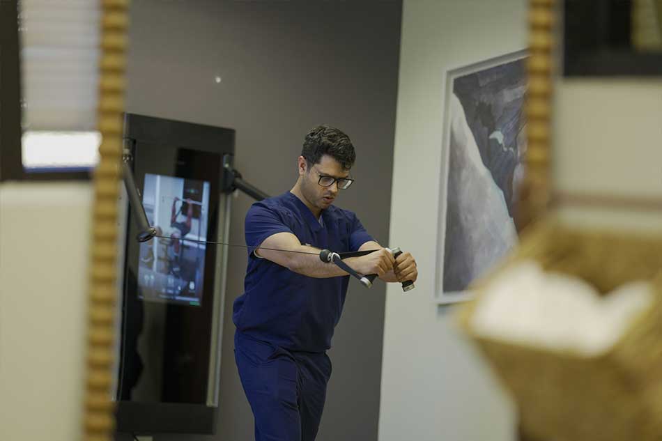 Synergy Health fitness and rehabilitation training session with resistance equipment.